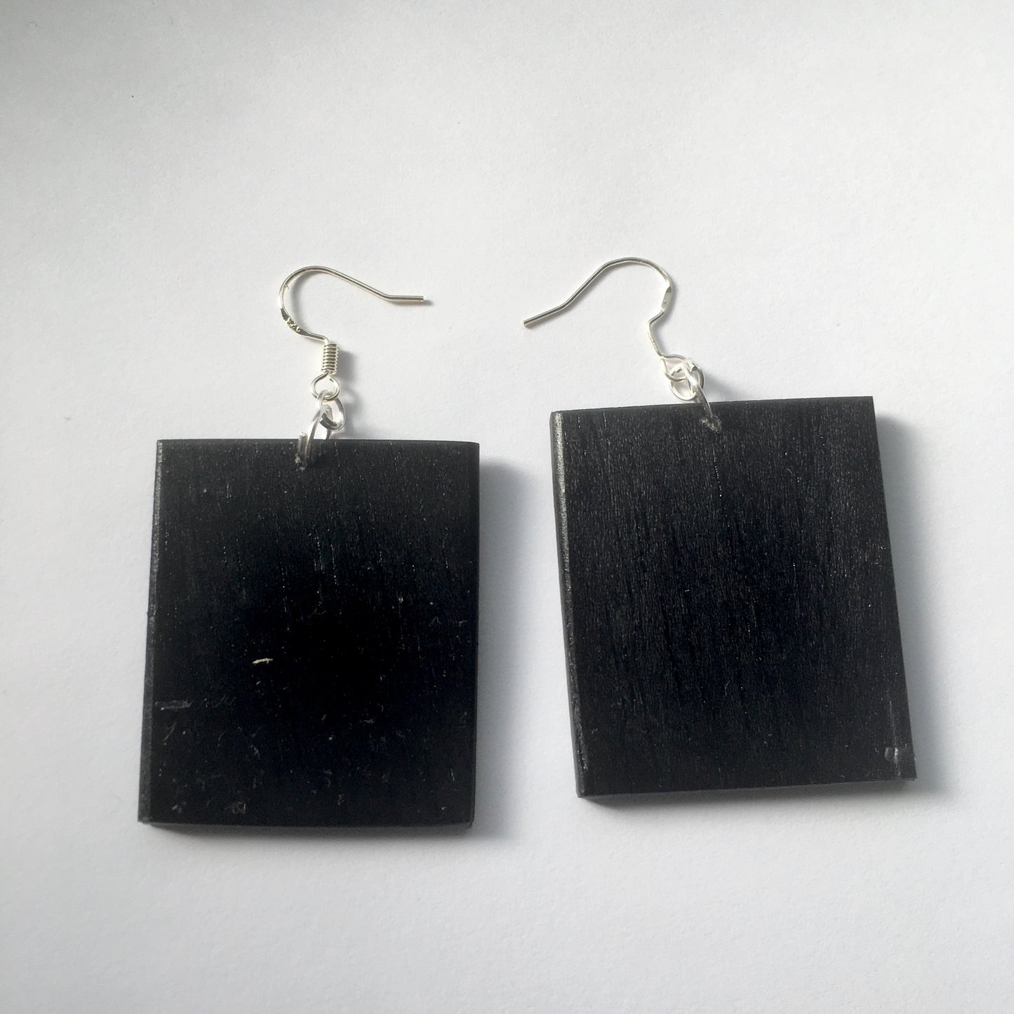 Sappho art, mismatched earrings