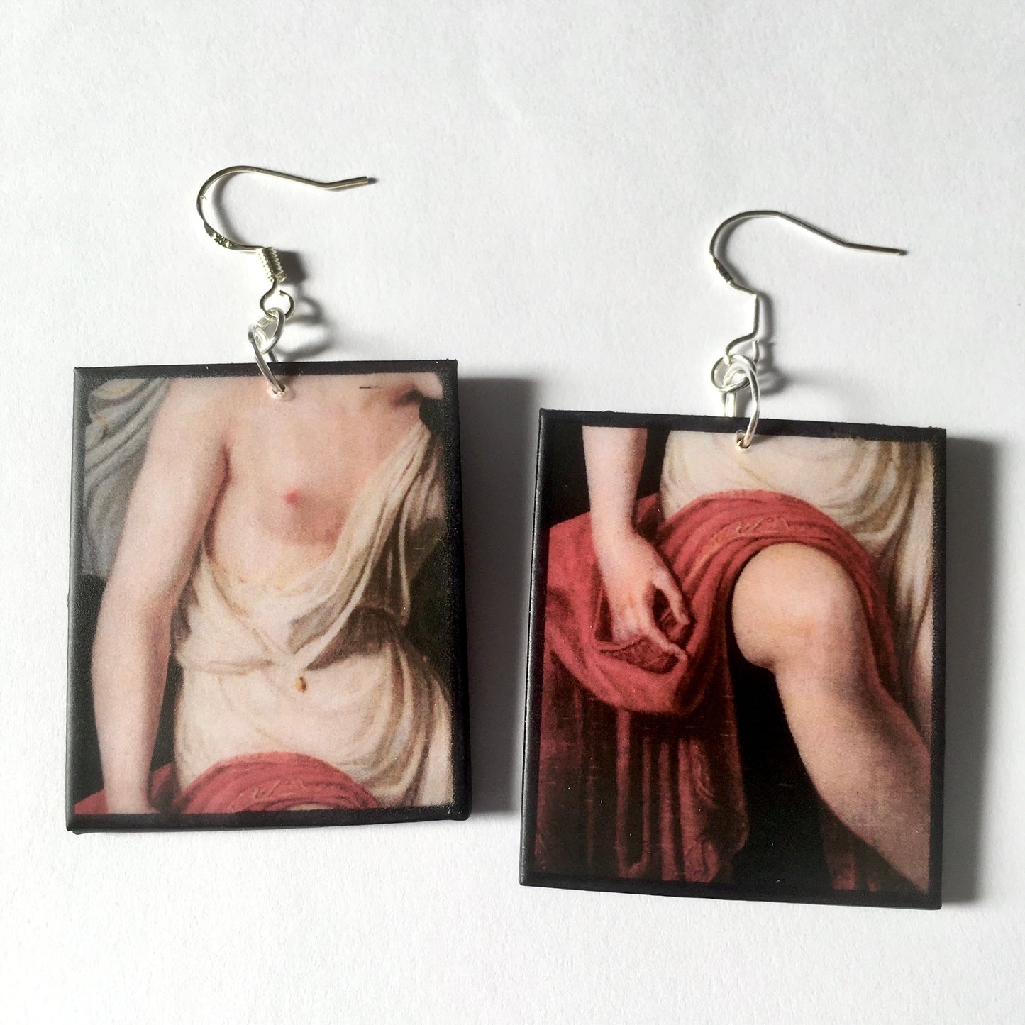 Sappho art, mismatched earrings