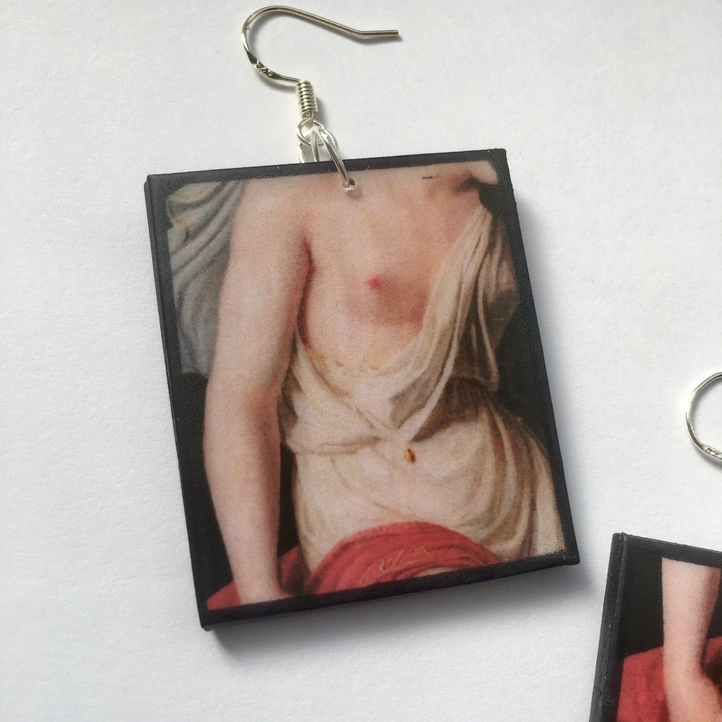 Sappho art, mismatched earrings