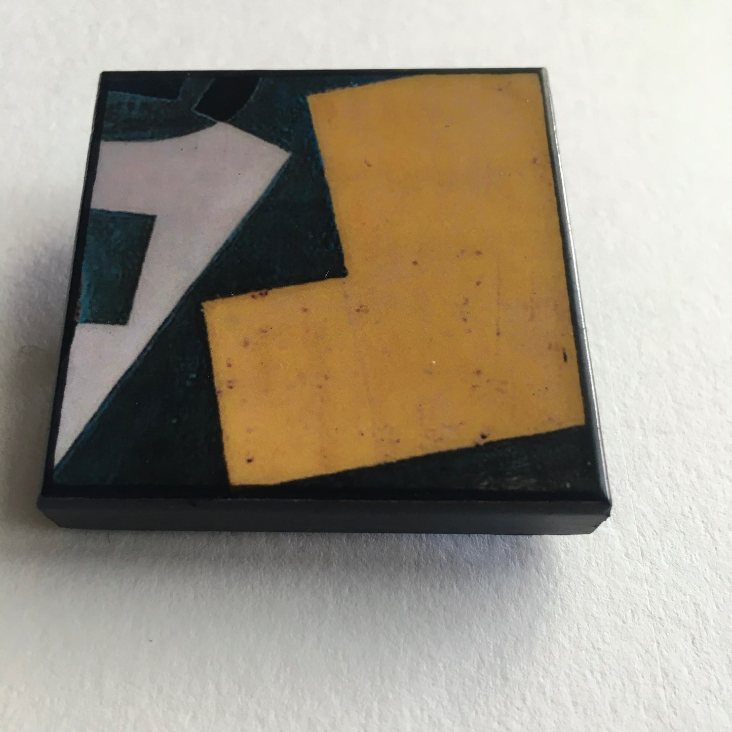 Art detail from Cubism painting by Spanish artist Juan Gris. Sustainable square brooch handmade from wood by Obljewellery