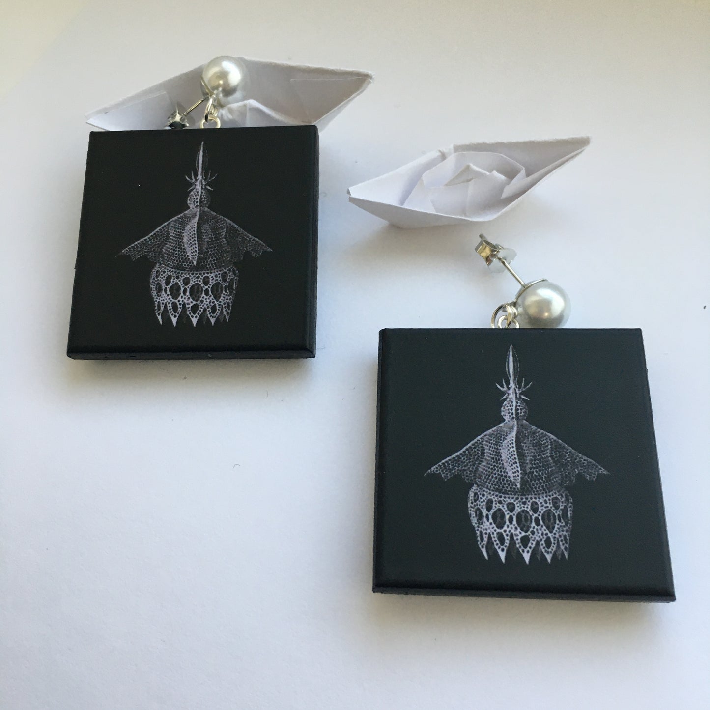 Sustainable wood earrings with stud pearls inspired by Ernst Haeckel marine shells, radiolaria black and white illustration. These earrings are completely handmade by Obljewellery
