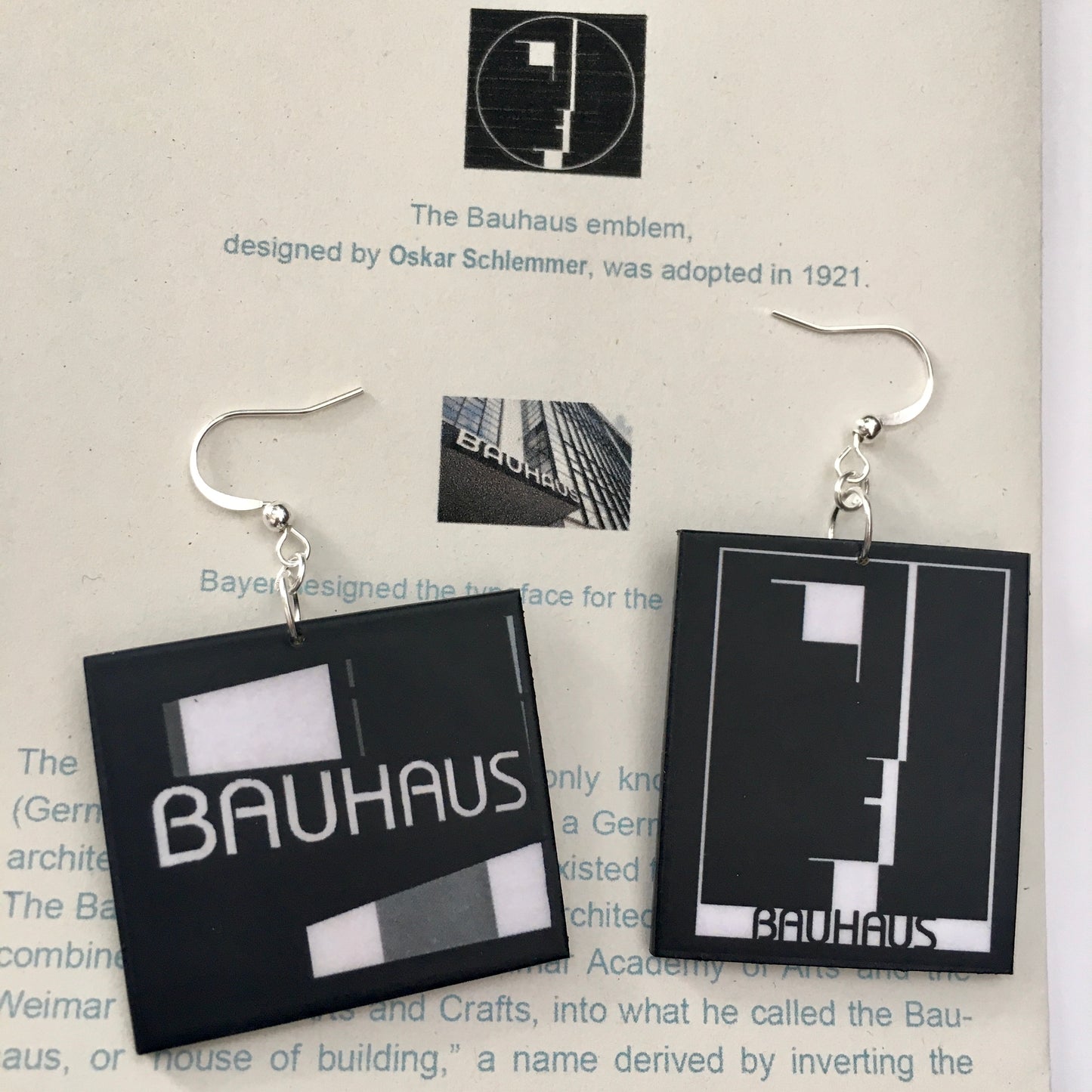Sustainable, asymmetrical art earrings inspired by the Bauhaus emblem, designed by Oskar Schlemmer.