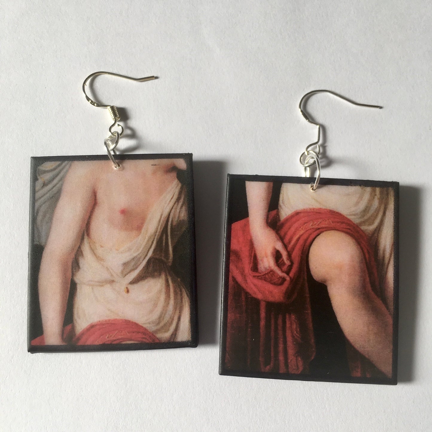 Sappho art, mismatched earrings