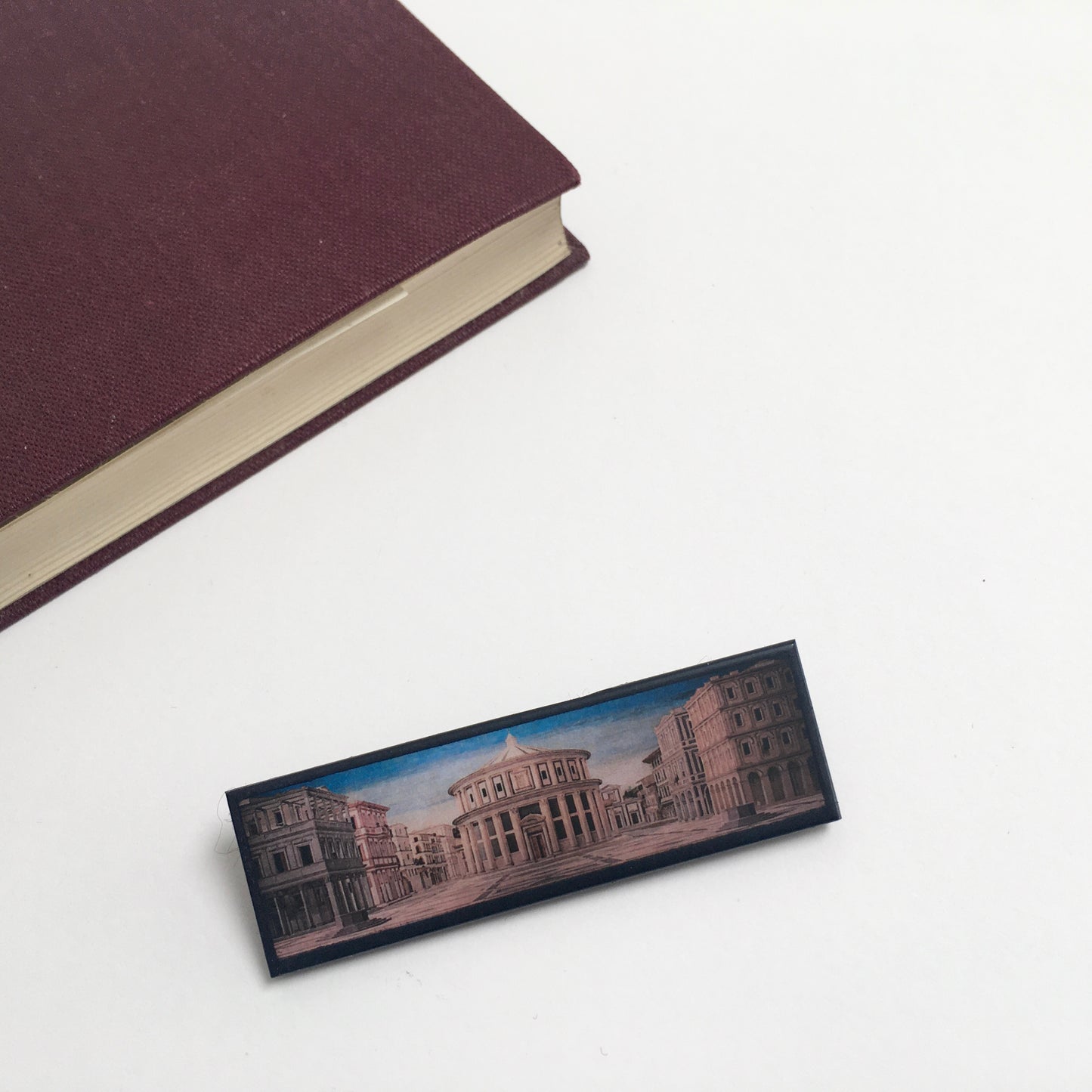 The IdealCity of Urbino, Berlin and Baltimore brooches