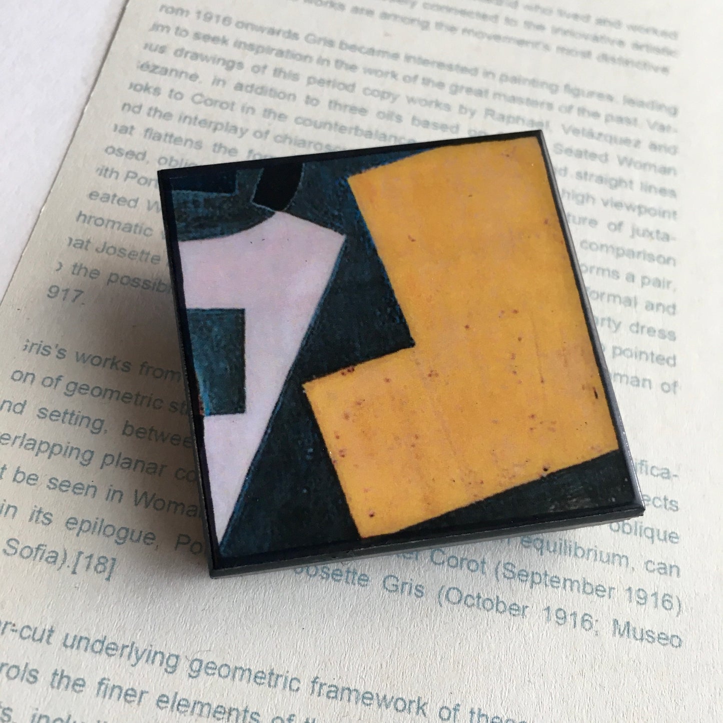 Art detail from Cubism painting by Spanish artist Juan Gris. Sustainable square brooch handmade from wood by Obljewellery