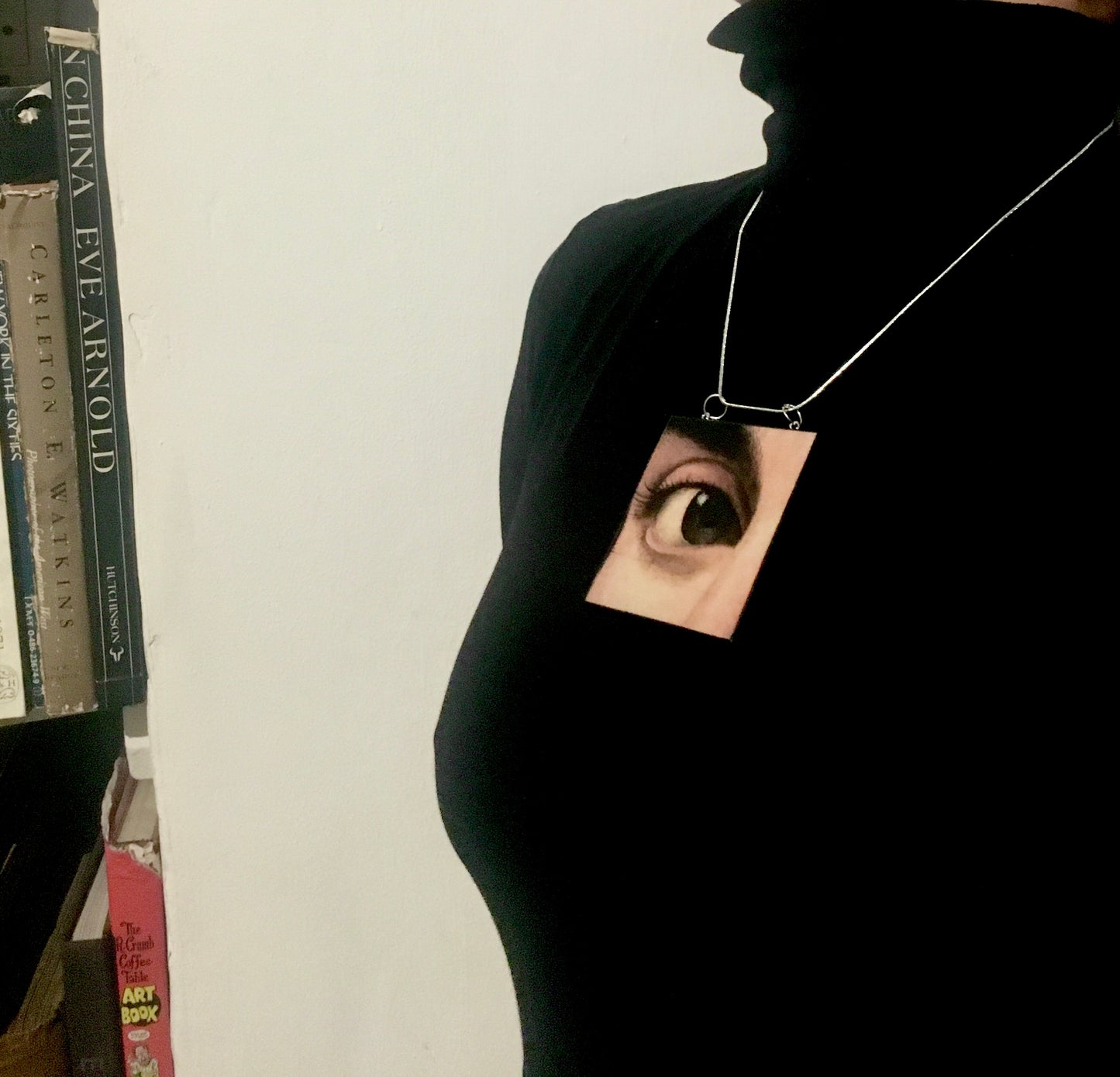 Sustainable wood pendant with an eye detail taken from a Renaissance art painting by Antonello da Messina. Handmade by Obljewellery