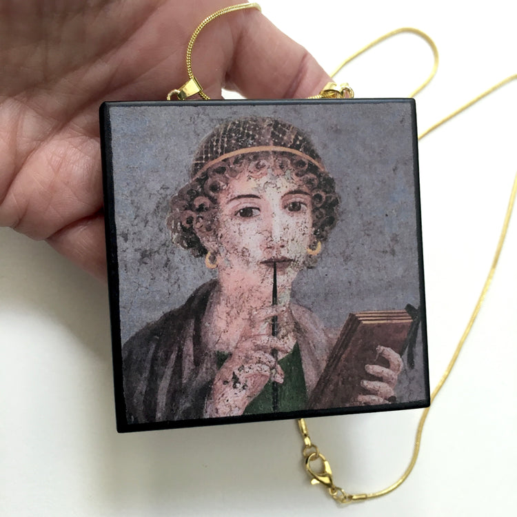Sappho jewellery handmade from sustainable wood by Obljewellery, The "Sappho" fresco, or "Portrait of a Young Woman with Stylus," is a celebrated 1st-century AD Roman fresco (c. 50–79 AD) discovered in Pompeii in 1760