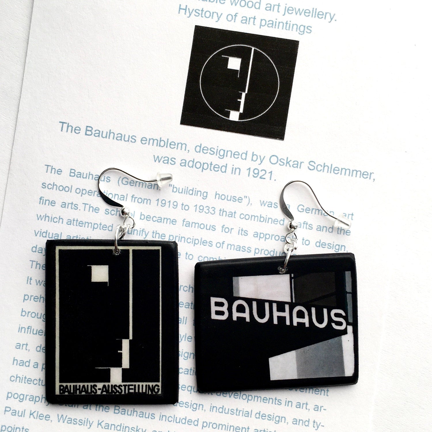 Inspired by Bauhaus movement, these asymmetrical, black and white earrings are in geometric style and they have the Logo of the art movement. These earrings are handmade by Obljewellery.