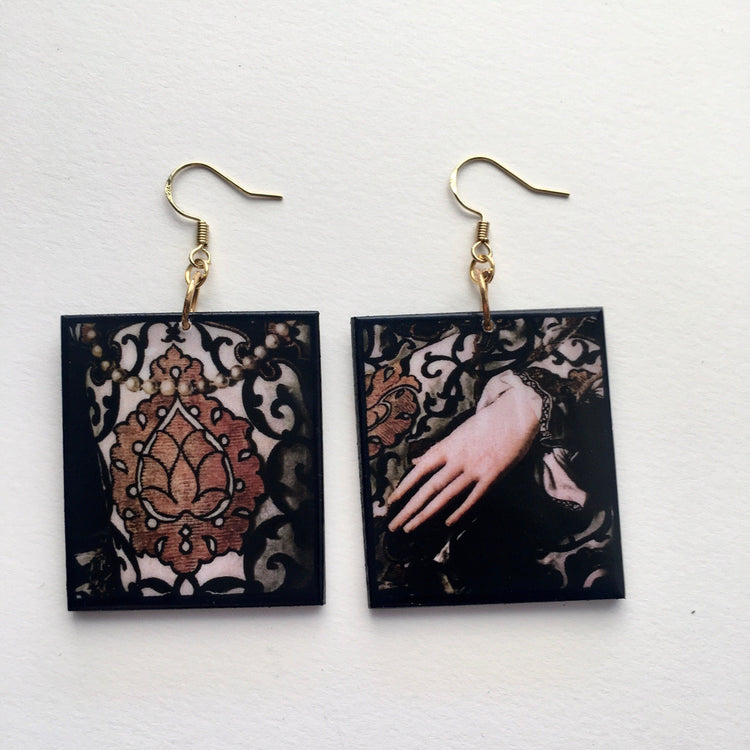 statement art earring, mismatched earrings on sustainable wood with an art detail from Agnolo Bronzino painting. Gold dress detail with a woman hand in Mannerism style. by Obljewellery