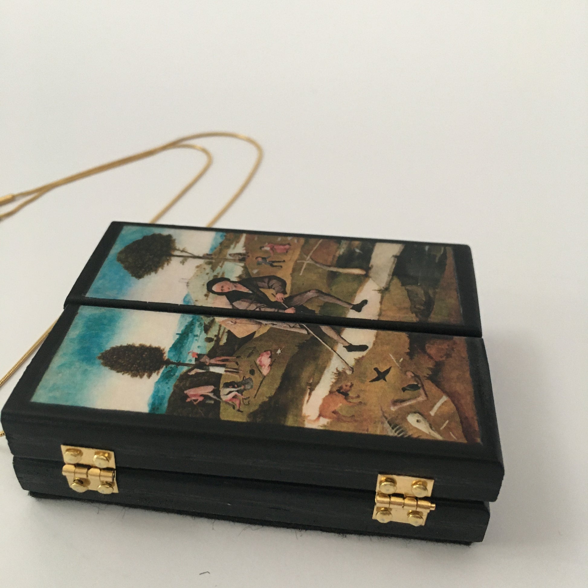 Triptych miniature art necklace handmade from sustainable wood reproduce The Haywain painting by Hieronymus Bosch. This aesthetic fully functioning art pendant necklace is created and designed by Obljewellery