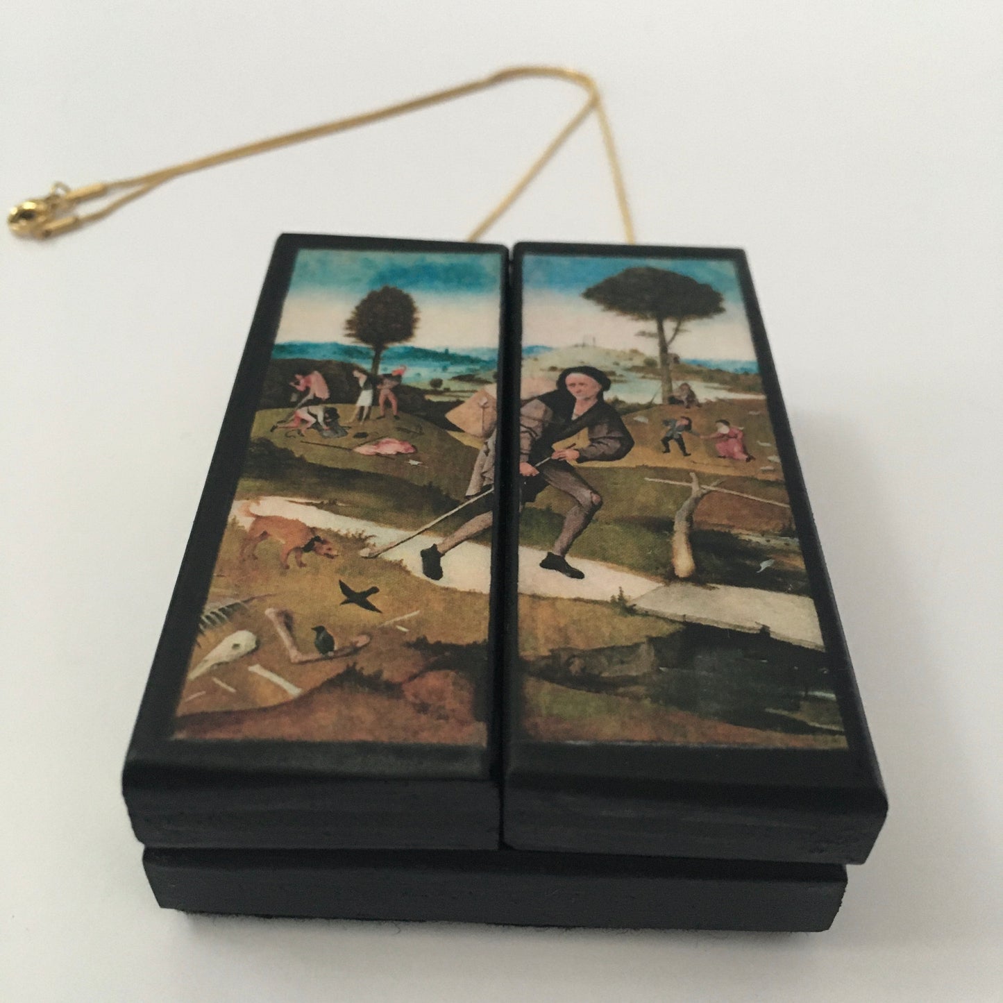 Triptych miniature art necklace handmade from sustainable wood reproduce The Haywain painting by Hieronymus Bosch. This aesthetic fully functioning art pendant necklace is created and designed by Obljewellery