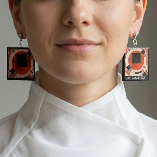Mismatched art based earrins inspired by Constructivist artist El Lissitzky handmade from sustainable wood by Obljewellery, square earrins in red black stud silver 