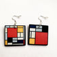 Mismatched earrings inspired by Mondrian.