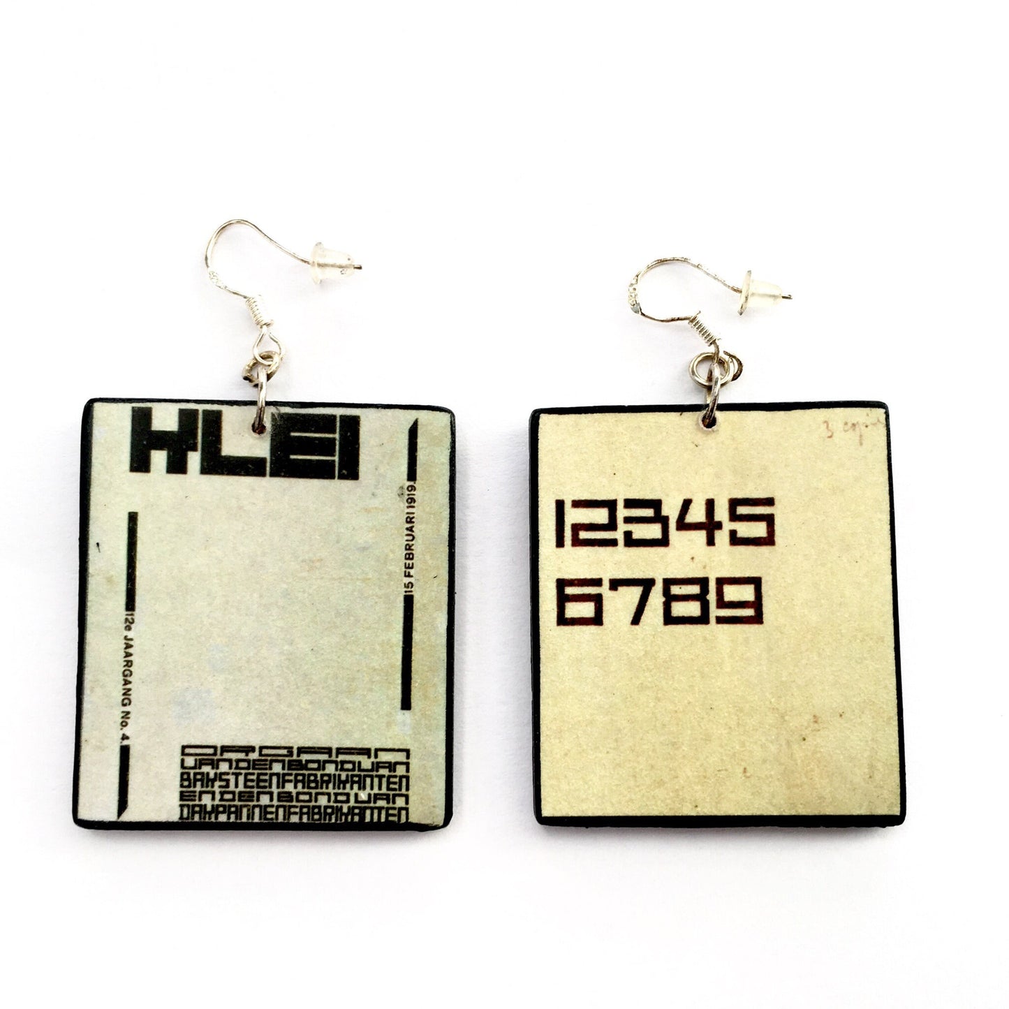 Handmade art earrings inspired by De Stijl art movement and his founded by Theo van Doesburg. Sustainable, mismatched earrings on wood with geometric, abstract art. Nunber 1 2 3 4 5 6 7 8 9 on top.