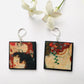Mismatched art earrings inspired by the Gustave Klimt painting "The Three Ages of Women" on sustainable wood these earrings shows a mother and son faces detail. Artsy mother day gift.