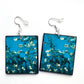 Sustainable wood earrings 4cm x 3.5 cm x 2/3 mm approx. Sterling silver 925 hooks.  The Van Gogh artsy earrings are inspired by the masterpiece "Almond Blossom" where the artist painted one of his favourite subjects  large flowering branches against a blue sky. The almond tree blooms is a symbol of new life, this painting was a gift for his brother Theo and his wife who had a son.  Vincent Van Gogh was inspired by Japanese prints.