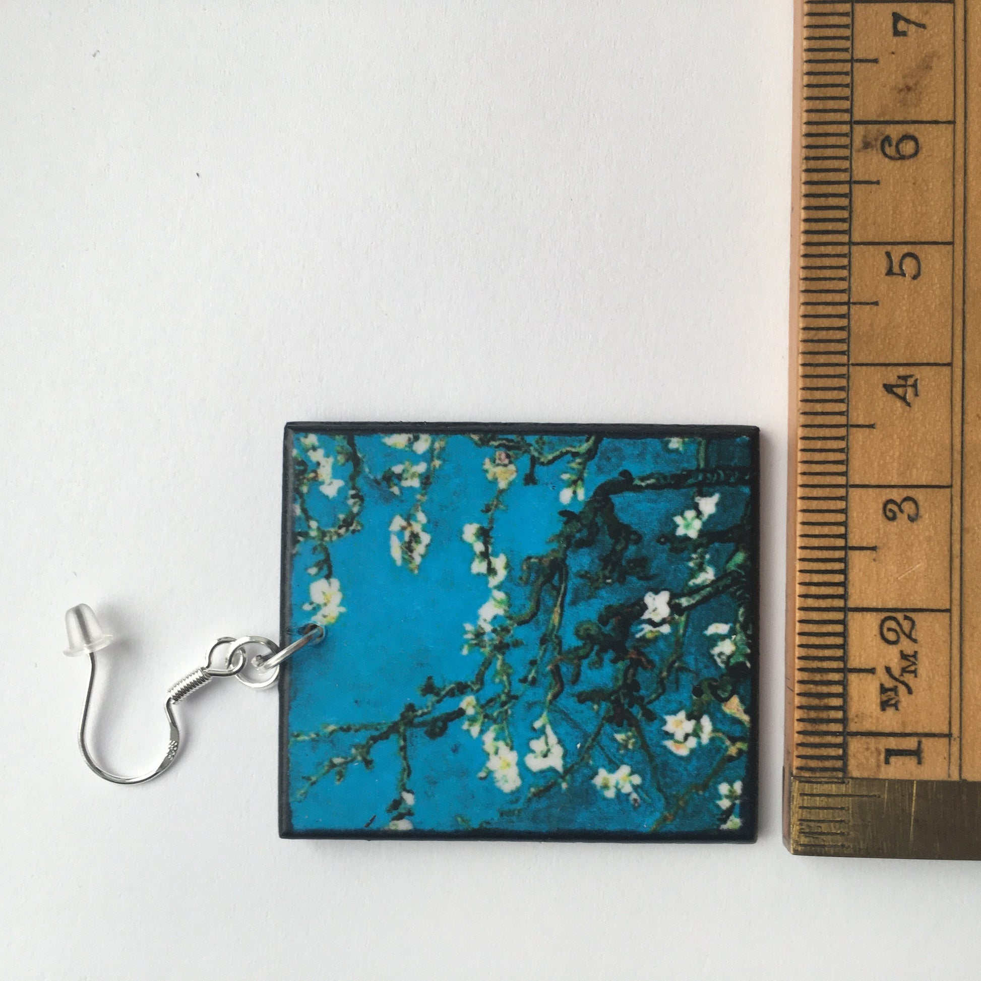 Sustainable wood earrings 4cm x 3.5 cm x 2/3 mm approx. Sterling silver 925 hooks.  The Van Gogh artsy earrings are inspired by the masterpiece "Almond Blossom" where the artist painted one of his favourite subjects  large flowering branches against a blue sky. The almond tree blooms is a symbol of new life, this painting was a gift for his brother Theo and his wife who had a son.  Vincent Van Gogh was inspired by Japanese prints.