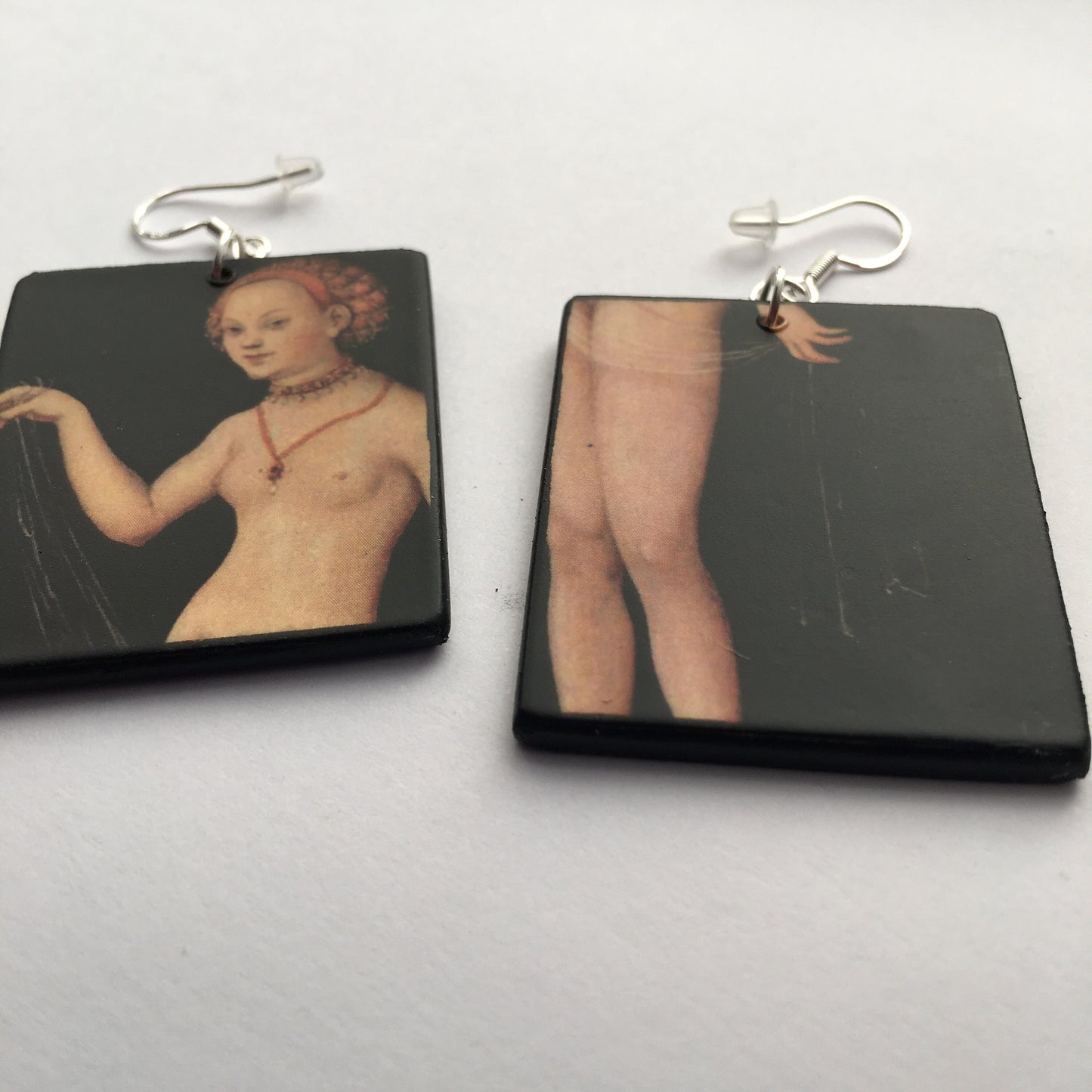 These sensual art earrings with Venus nude art detail by the German Renaissance famous artist Lucas Cranach the older are eccentric wooden mismatched earrings. 