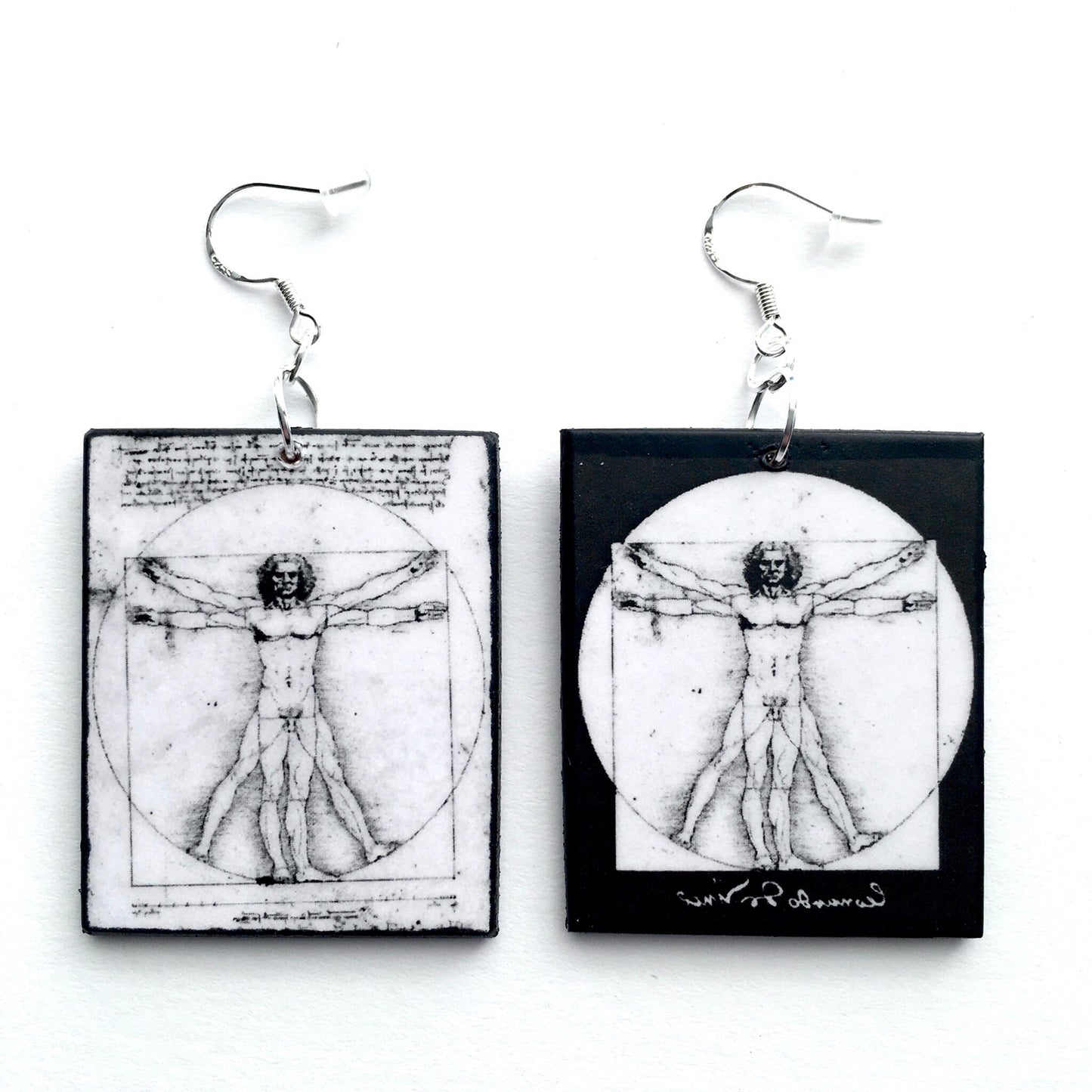 Leonardo da Vinci earrings. Black and white, sustainable art earring with "Vitruvian Men" sacret geometry art. Obljewellery Leonardo da Vinci collection.