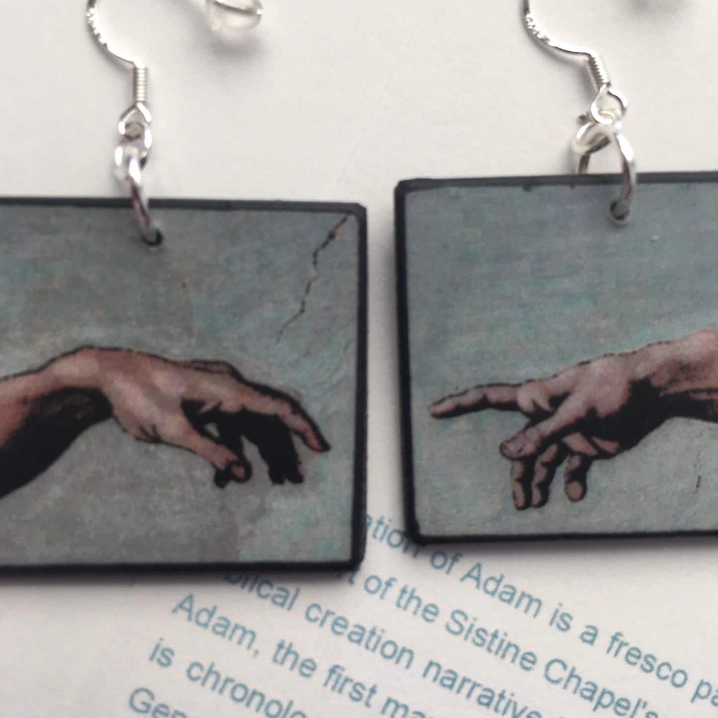These earrings echo the famous scene of the Creation of Adam, frescoed in the Sistine Chapel by Michelangelo Buonarroti; Italian Renaissance artist.  Handmade by Obljewellery from sustainable wood with sterling silver hooks.