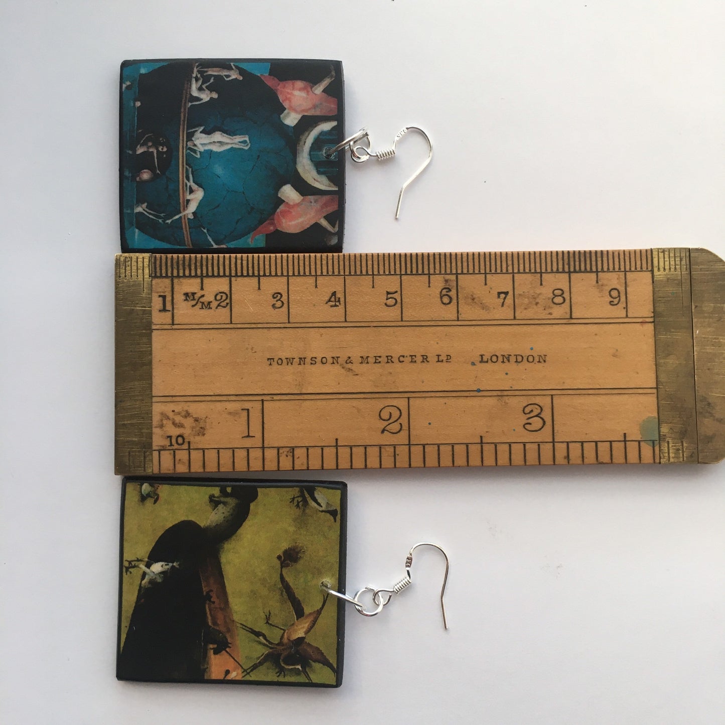 Set of mismatched earrings and one brooch based on Hieronymus Bosch art.