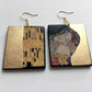 Gustav Klimt, The Kiss painting inspired the Obljewellery shop to create these earrings on rectangular wood with a gold leaf detail.
