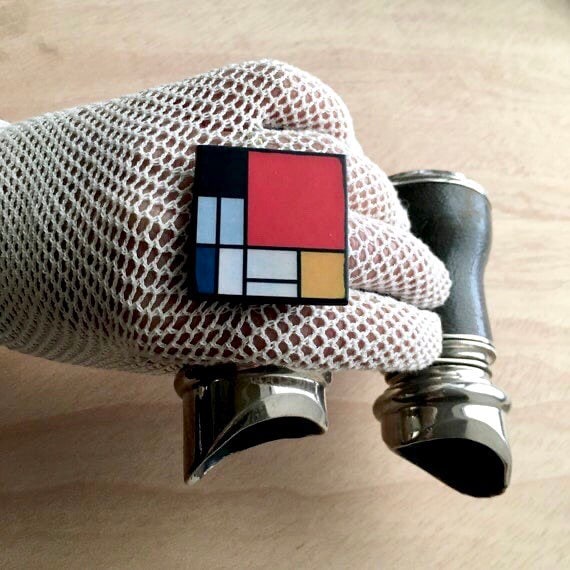 Wooden, 3.5 cm squared geometric art ring in red, blue, yellow and white colors. Obljewellery shop is inspired by Mondrian's De Stijl period works.