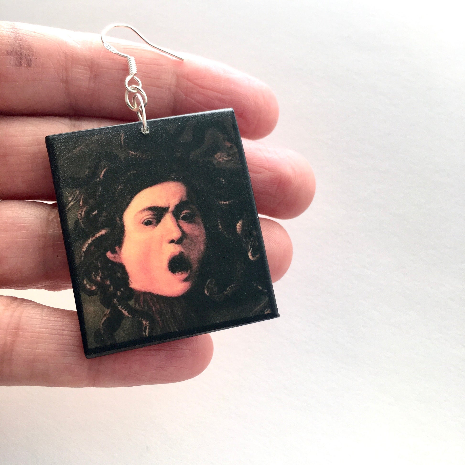 Medusa art earrings, impressive painting by Italian artist Caravaggio (Michelangelo Merisi). Lightweight wood, gothic style earrings with sterling silver hooks, completely handmade by obljewellery