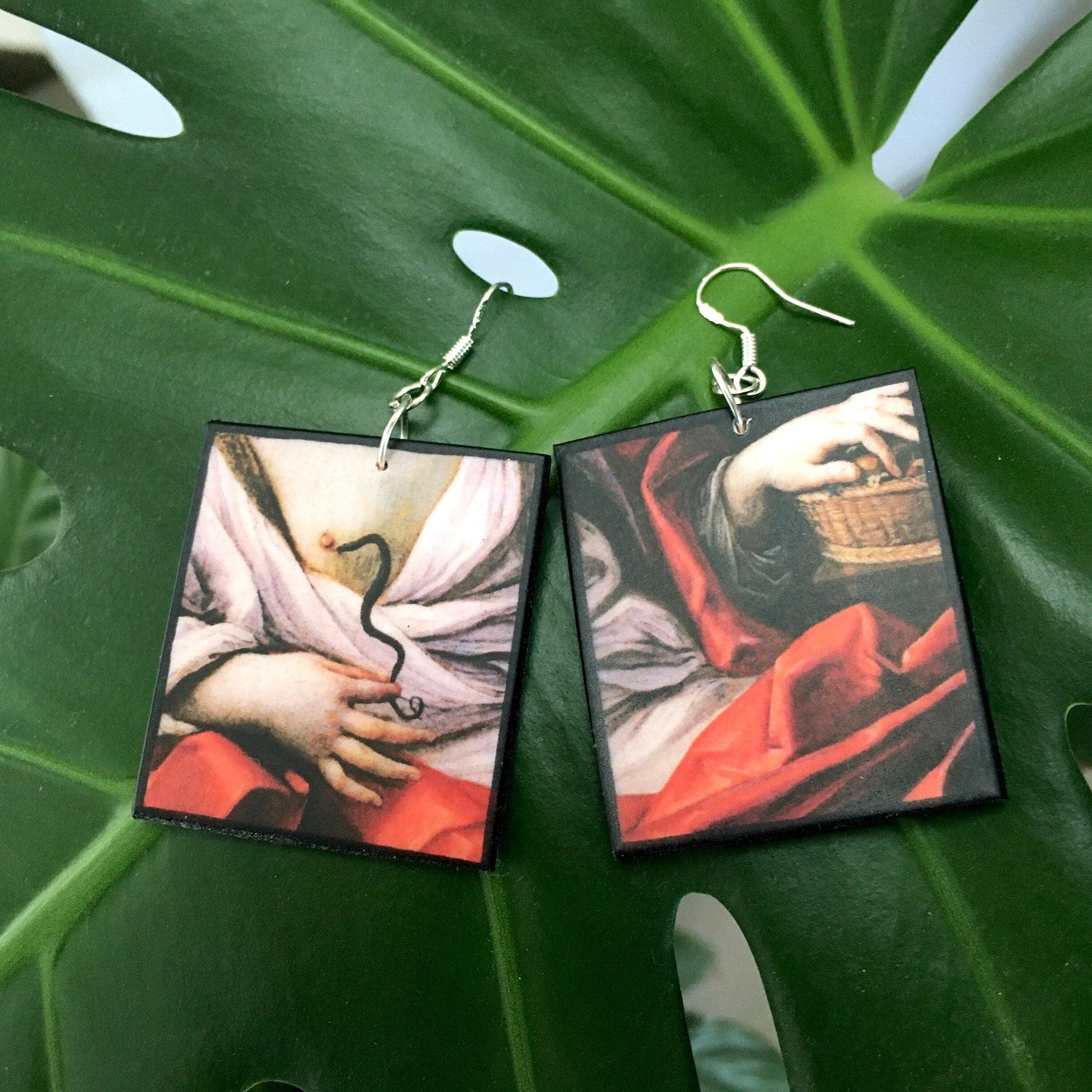 Sustainable art earrings with Guido Reni painting Cleopatra. Art details earrings on wood.