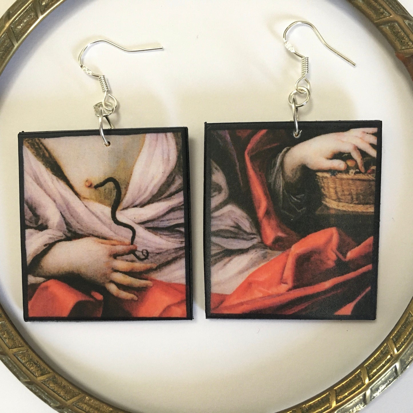 Cleopatra poisonous snake art painting by Italian artist Guido Reni on top of these aesthetic, uncommon, lightweight earrings. The earrings are made on sustainable wood with sterling silver hooks.  Obljewellery artsy gifts.