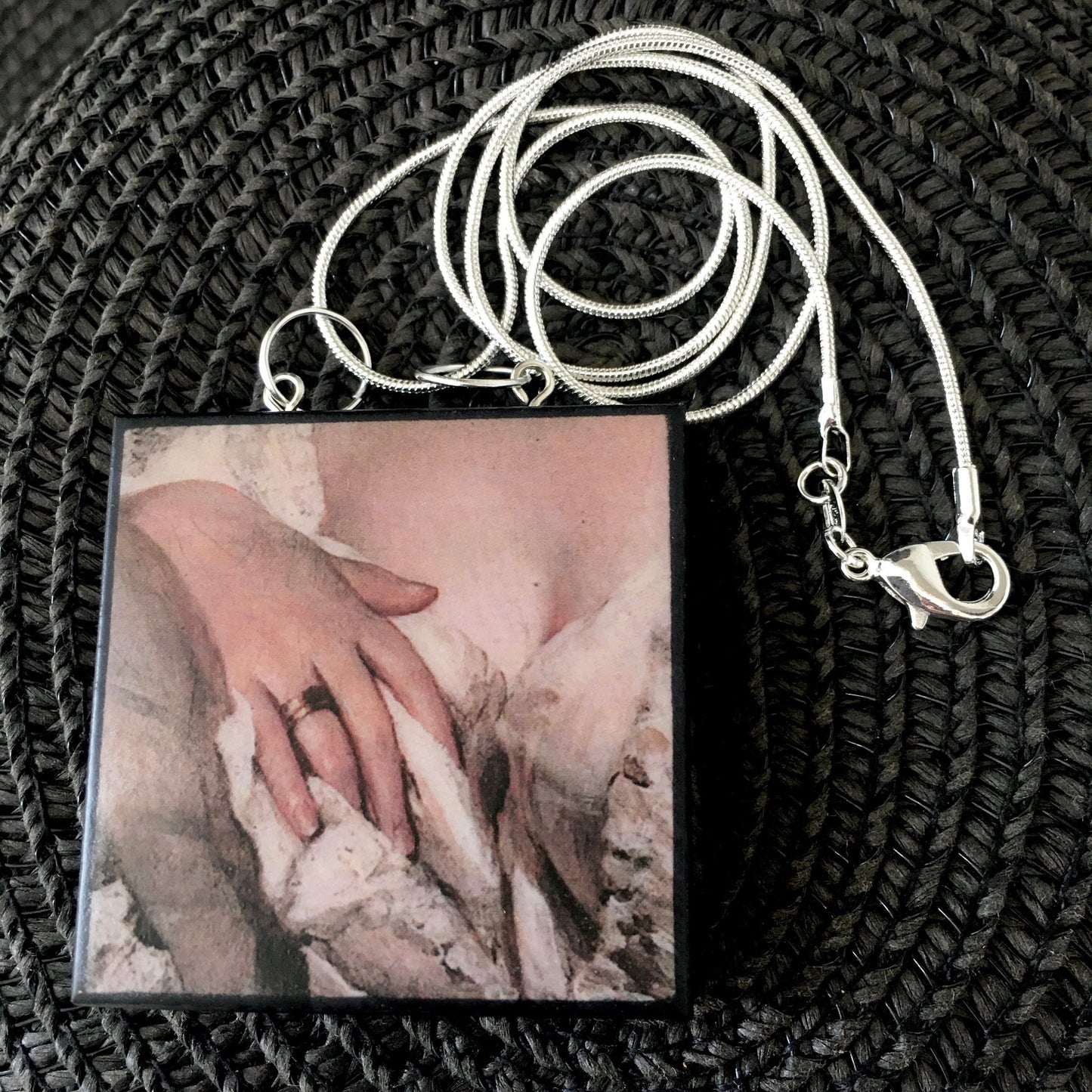 Statement necklace sterling silver chain with a wooden squared pendant inspired by a sensual art detail of a hand. quirky gift on obljewellery shop.