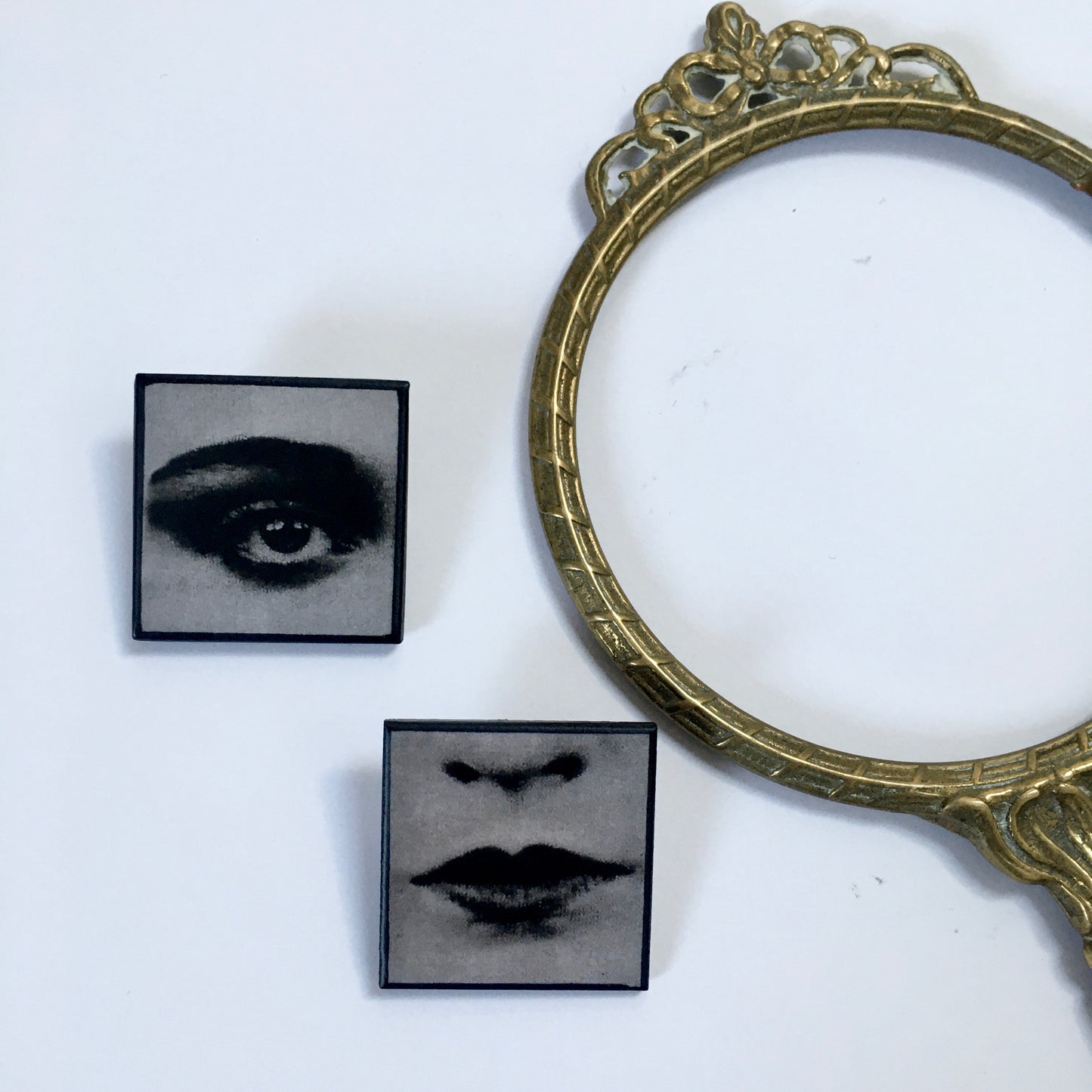 Set of two brooches, lips and eye