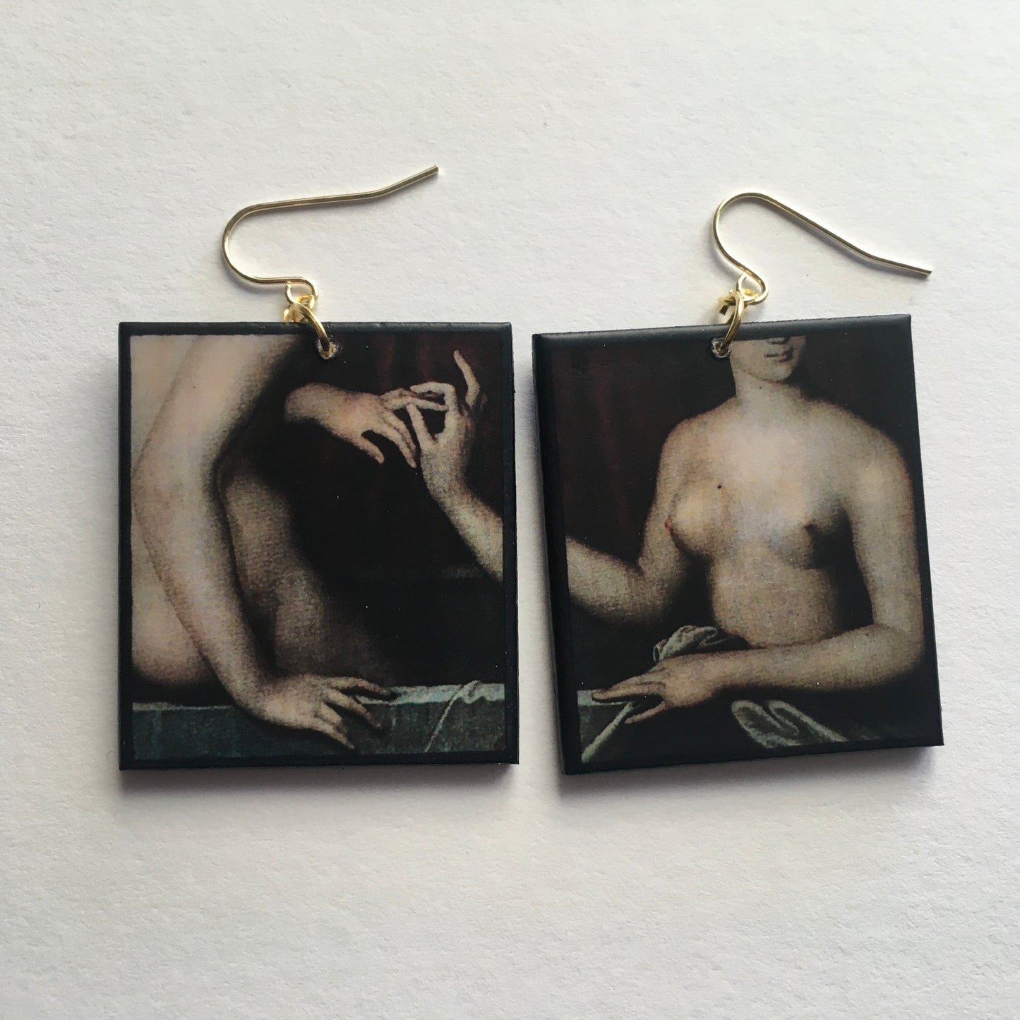 Sensual art detail earrings handmade from sustainable wood by Obljewellery. The detail comes from a painting by Ecole de Fontainebleau, two necked women engagement ring moment.