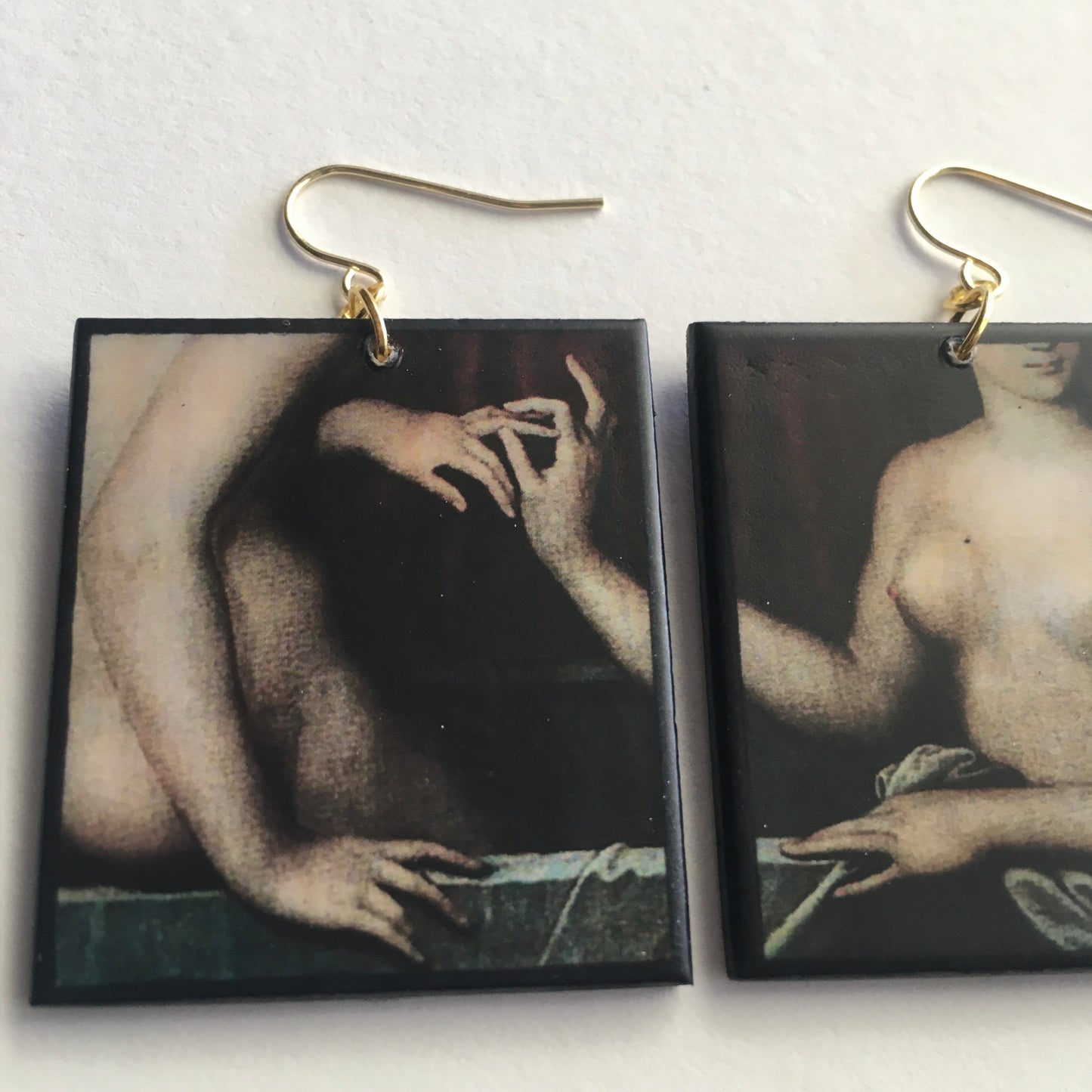 Sensual art detail earrings handmade from sustainable wood by Obljewellery. The detail comes from a painting by Ecole de Fontainebleau, two necked women engagement ring moment.