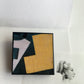 Art detail from Cubism painting by Spanish artist Juan Gris. Sustainable square brooch handmade from wood by Obljewellery 
