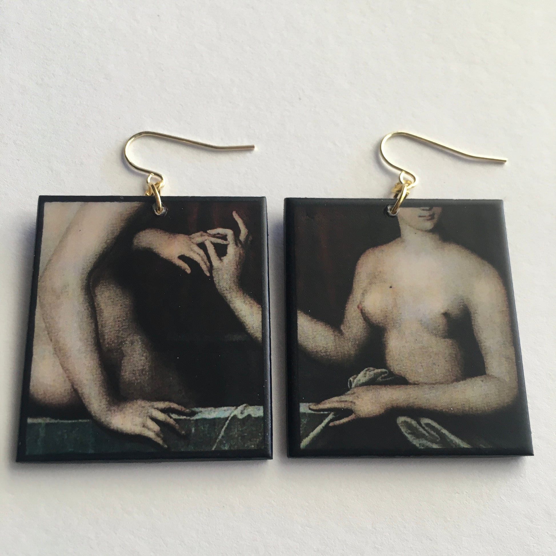 Sensual art detail earrings handmade from sustainable wood by Obljewellery. The detail comes from a painting by Ecole de Fontainebleau, two necked women engagement ring moment.