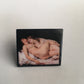 Gustave Courbet art statement ring. Nude two wamen on the bed painting. Sustainable ring on wood.