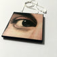 Sustainable wood pendant with an eye detail taken from a Renaissance art painting by Antonello da Messina. Handmade by Obljewellery