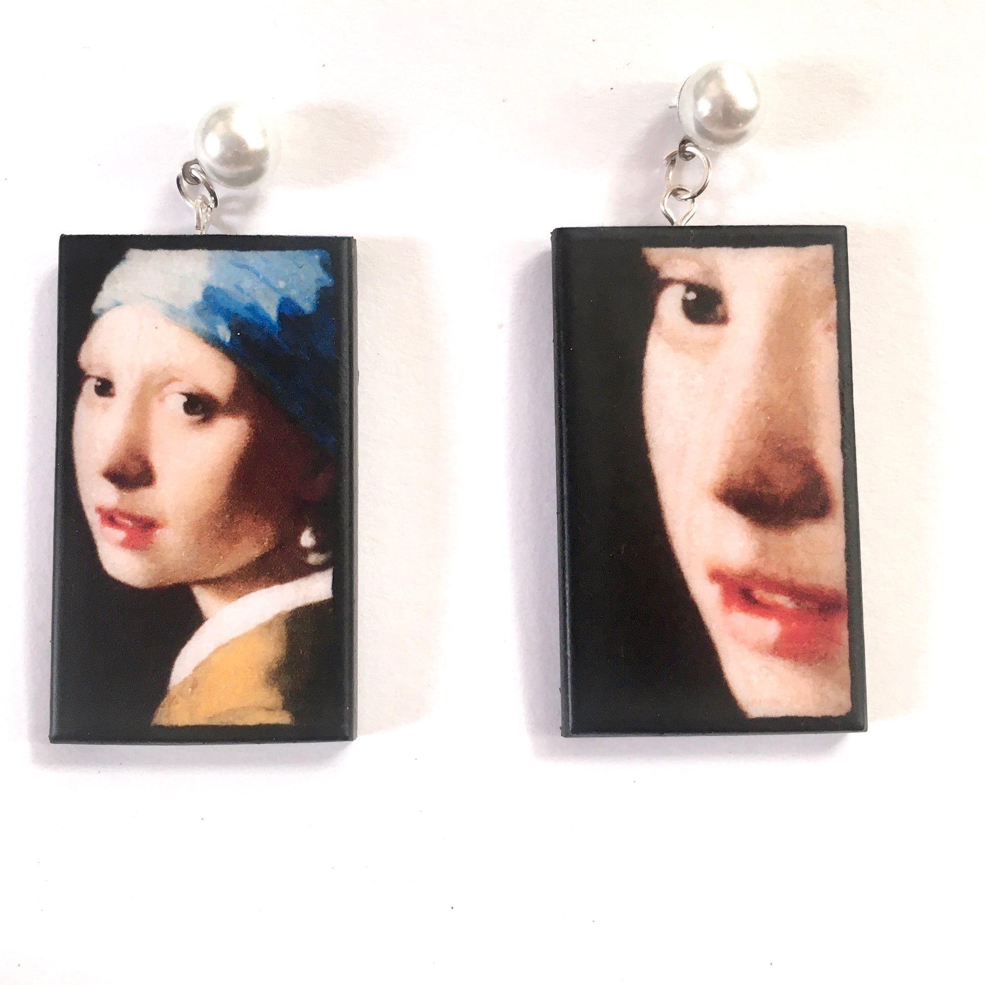 The girl with a pearl earring is a painting by Vermeer. These art details earring show the face of the girl they are in sustainable weood and have the stud earrings with pearls. Handmade mismatched earrings by Obljewellery