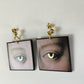Gold eyes earrings