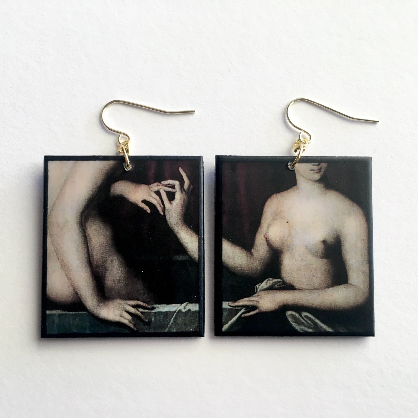 Sensual art detail earrings handmade from sustainable wood by Obljewellery. The detail comes from a painting by Ecole de Fontainebleau, two necked women engagement ring moment.